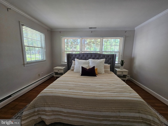 bedroom featuring baseboards, ornamental molding, dark wood-type flooring, and a baseboard heating unit