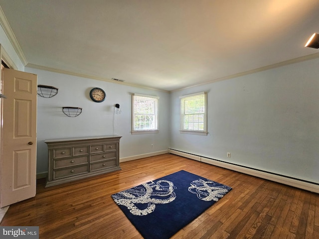 bedroom featuring wood-type flooring, ornamental molding, visible vents, baseboards, and baseboard heating