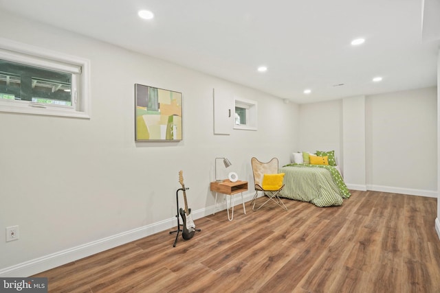 bedroom featuring baseboards, recessed lighting, and wood finished floors
