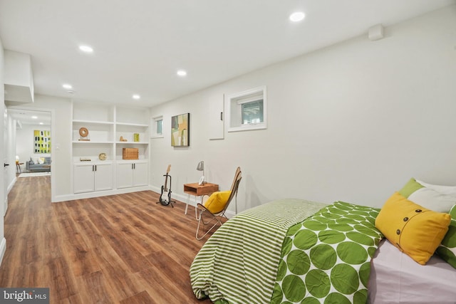 bedroom with recessed lighting, baseboards, and wood finished floors