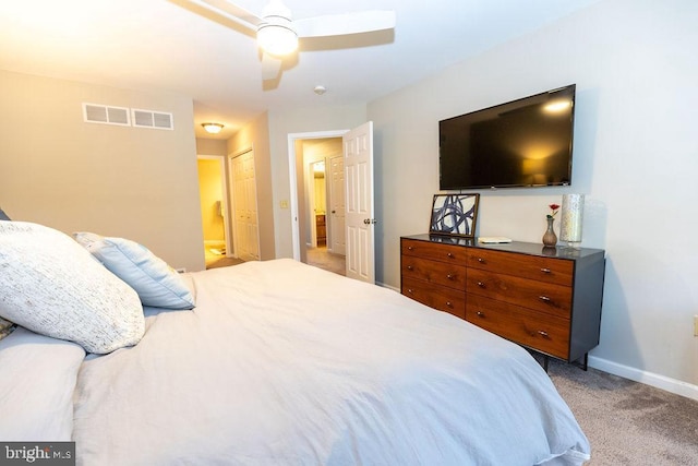 bedroom with baseboards, visible vents, a ceiling fan, and light colored carpet