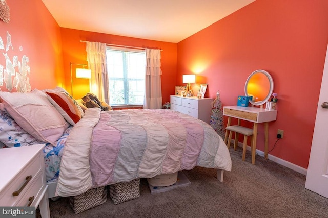 bedroom featuring carpet flooring and baseboards