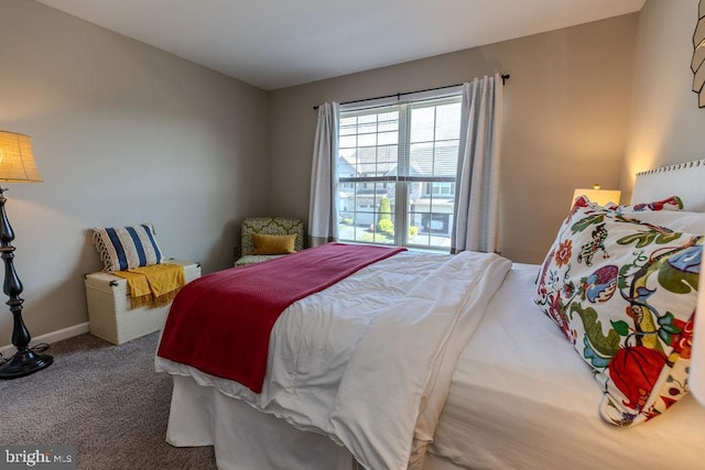 bedroom featuring carpet floors and baseboards