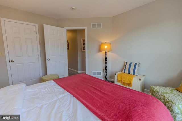 bedroom with visible vents and baseboards