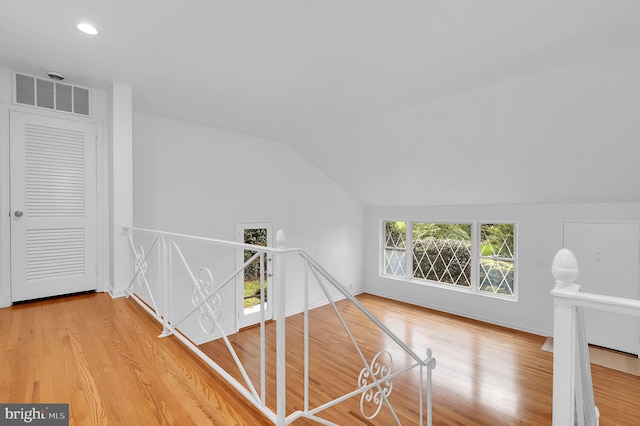 9235 E Parkhill Dr, Bethesda, MD 20814 - hall with an upstairs landing, vaulted ceiling, wood finished floors, and recessed lighting