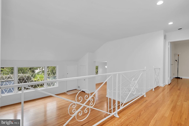 9235 E Parkhill Dr, Bethesda, MD 20814 - corridor with lofted ceiling, an upstairs landing, wood finished floors, recessed lighting, and baseboards