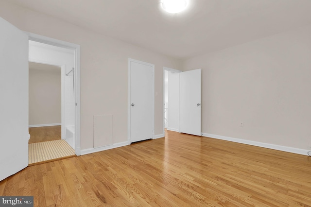9235 E Parkhill Dr, Bethesda, MD 20814 - unfurnished bedroom with light wood-type flooring and baseboards