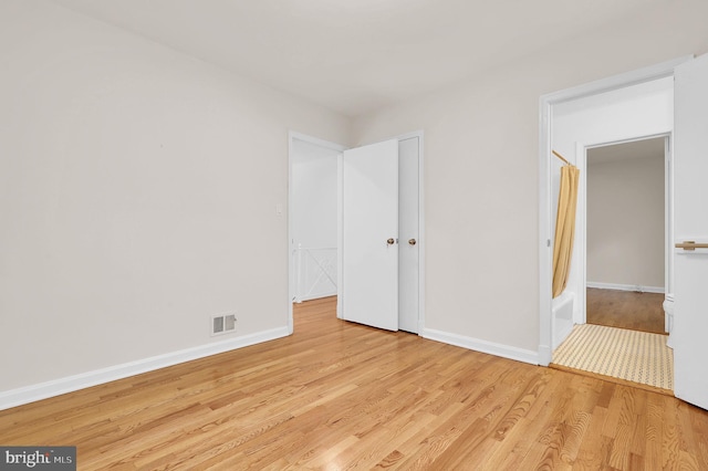 9235 E Parkhill Dr, Bethesda, MD 20814 - unfurnished bedroom featuring wood finished floors and baseboards