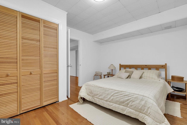 9235 E Parkhill Dr, Bethesda, MD 20814 - bedroom featuring a closet and wood finished floors