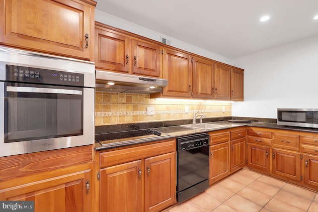 9235 E Parkhill Dr, Bethesda, MD 20814 - kitchen featuring black appliances, under cabinet range hood, a sink, brown cabinets, and recessed lighting