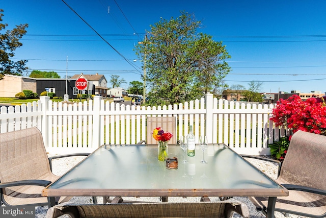 view of patio / terrace featuring fence and outdoor dining area