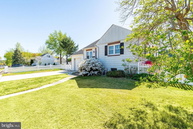 bungalow with a garage, fence, a front yard, board and batten siding, and concrete driveway