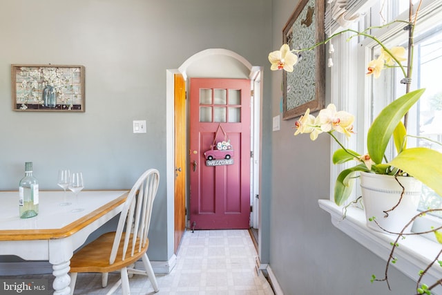 interior space featuring tile patterned floors and baseboards