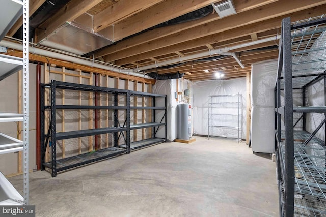 unfinished below grade area with electric water heater