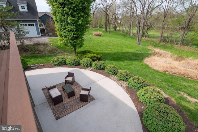 view of property's community featuring a lawn and a garage