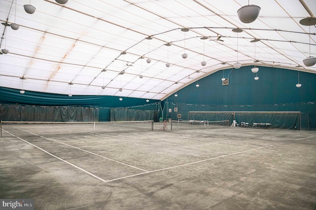 view of sport court with fence