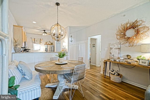 33192 N Village Loop Unit 5204, Lewes, DE 19958 - dining area featuring wood finished floors and a notable chandelier