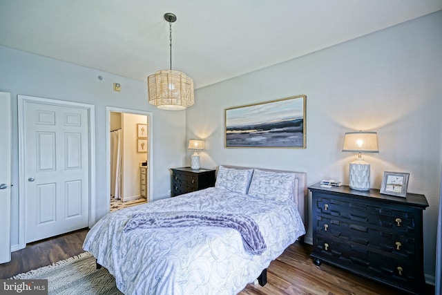 33192 N Village Loop Unit 5204, Lewes, DE 19958 - bedroom with wood finished floors, a chandelier, and baseboards