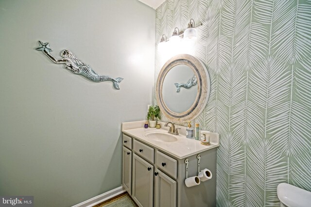 33192 N Village Loop Unit 5204, Lewes, DE 19958 - half bathroom with toilet, wallpapered walls, and vanity