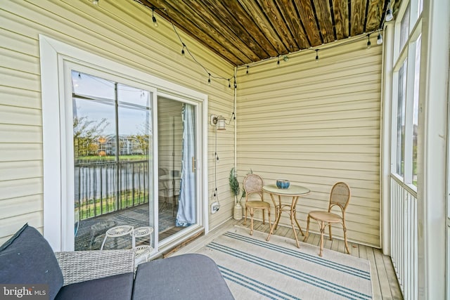 33192 N Village Loop Unit 5204, Lewes, DE 19958 - sunroom featuring a water view