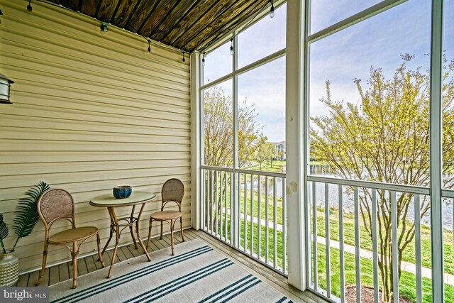 33192 N Village Loop Unit 5204, Lewes, DE 19958 - sunroom with a wealth of natural light and a water view