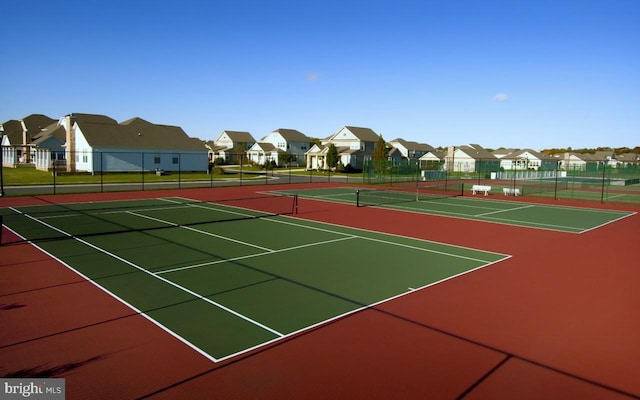 33192 N Village Loop Unit 5204, Lewes, DE 19958 - view of sport court with fence and a residential view