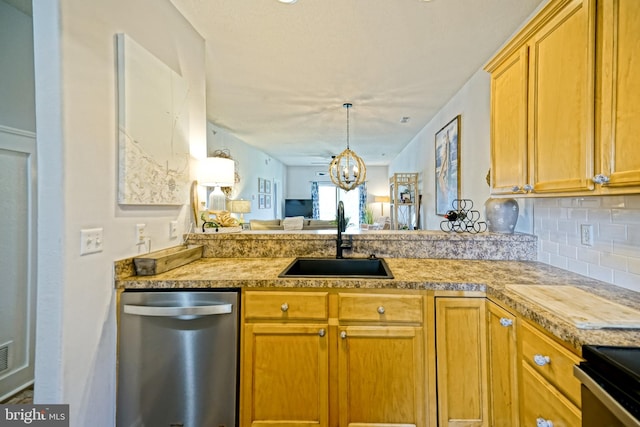 33192 N Village Loop Unit 5204, Lewes, DE 19958 - kitchen with decorative backsplash, a chandelier, light countertops, dishwasher, and a sink