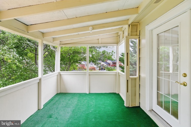 unfurnished sunroom with plenty of natural light