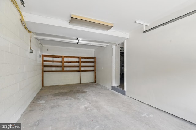 garage featuring concrete block wall