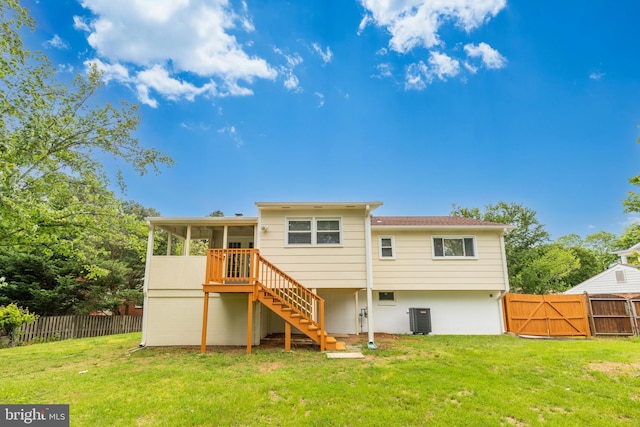 back of property featuring stairs, a sunroom, a gate, and central air condition unit