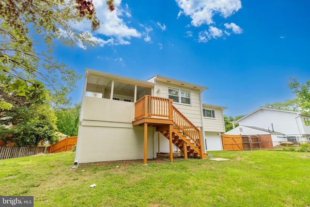 back of property featuring stairs and a deck