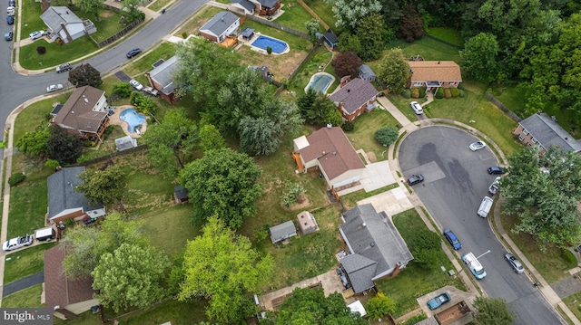 aerial view of property's location with nearby suburban area