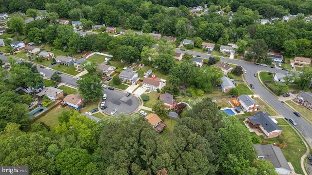 aerial view of property's location with nearby suburban area