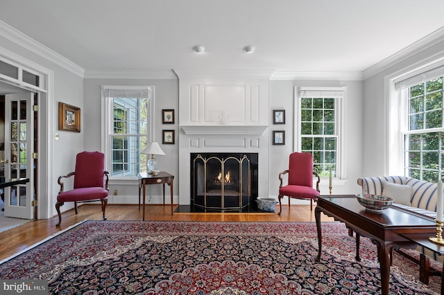 4064 Howell Rd, Malvern, PA 19355 - living area featuring baseboards, ornamental molding, a lit fireplace, and wood finished floors