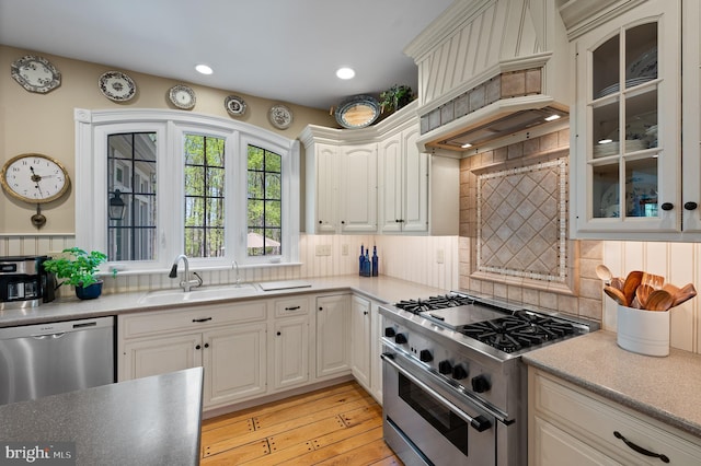 4064 Howell Rd, Malvern, PA 19355 - kitchen featuring a sink, premium range hood, decorative backsplash, and stainless steel appliances