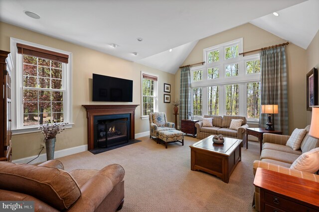 4064 Howell Rd, Malvern, PA 19355 - living room with a fireplace with flush hearth, plenty of natural light, vaulted ceiling, and light carpet