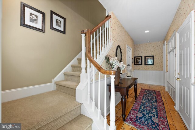 4064 Howell Rd, Malvern, PA 19355 - staircase featuring recessed lighting, wallpapered walls, wainscoting, and hardwood / wood-style floors