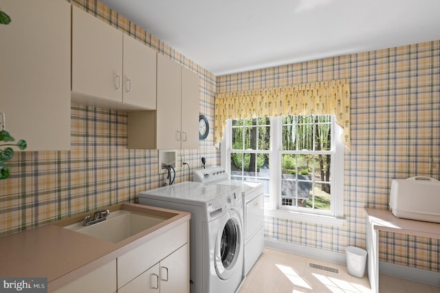 4064 Howell Rd, Malvern, PA 19355 - laundry area featuring visible vents, wallpapered walls, washing machine and clothes dryer, a sink, and cabinet space