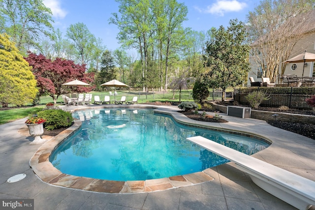 4064 Howell Rd, Malvern, PA 19355 - view of pool with a fenced backyard, a fenced in pool, a diving board, and a patio area