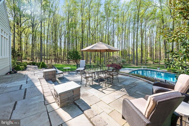 4064 Howell Rd, Malvern, PA 19355 - view of patio with a fenced backyard, outdoor dining area, and an outdoor pool