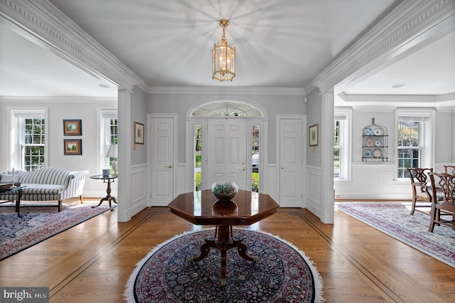 4064 Howell Rd, Malvern, PA 19355 - entryway featuring crown molding, a decorative wall, wood finished floors, and a notable chandelier