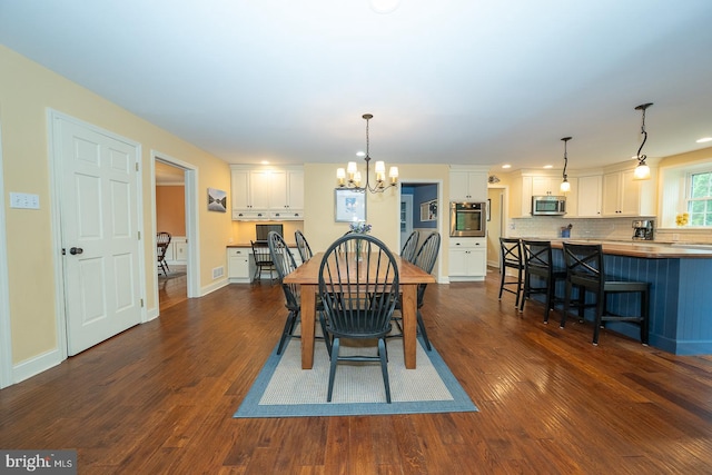 dining room featuring visible vents, recessed lighting, dark wood finished floors, a chandelier, and baseboards