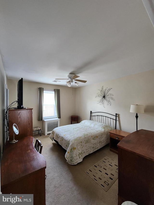 2906 Sylvan Ave, Baltimore, MD 21214 - bedroom with radiator, carpet floors, and a ceiling fan
