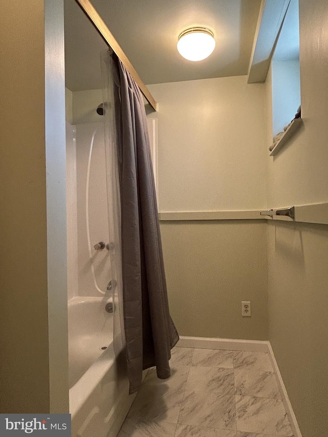 2906 Sylvan Ave, Baltimore, MD 21214 - bathroom with marble look tiles, baseboards, and shower / bathtub combination with curtain