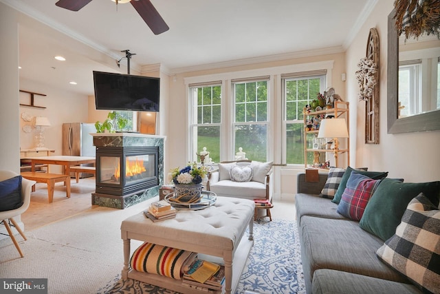 8733 Boulder Ridge Rd, Laurel, MD 20723 - living area with ornamental molding, a multi sided fireplace, plenty of natural light, and ceiling fan