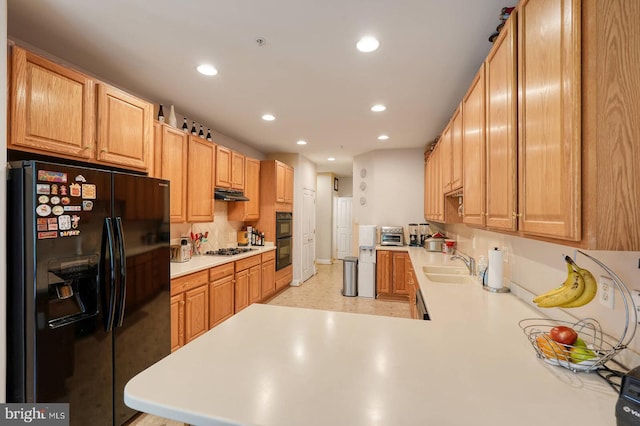8733 Boulder Ridge Rd, Laurel, MD 20723 - kitchen with black appliances, under cabinet range hood, light countertops, a sink, and recessed lighting