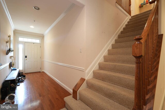 8733 Boulder Ridge Rd, Laurel, MD 20723 - entrance foyer with crown molding, stairway, wood finished floors, baseboards, and recessed lighting