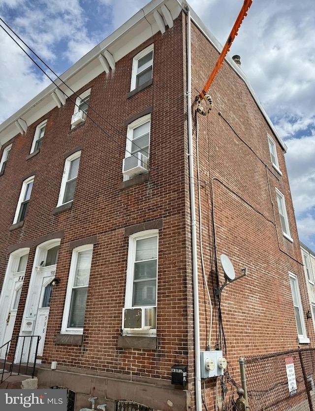 view of building exterior featuring cooling unit