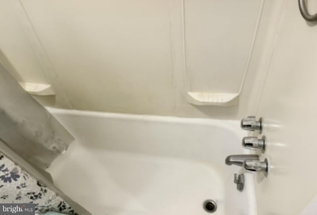 full bath featuring a bathtub and a shower