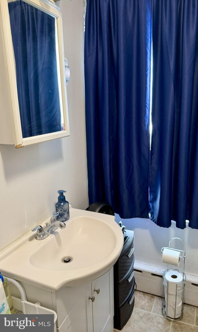 bathroom featuring vanity and a baseboard radiator